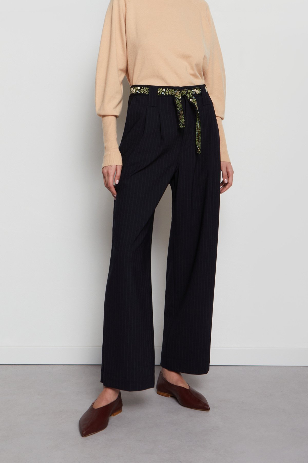 Pinstripe trousers with pleats