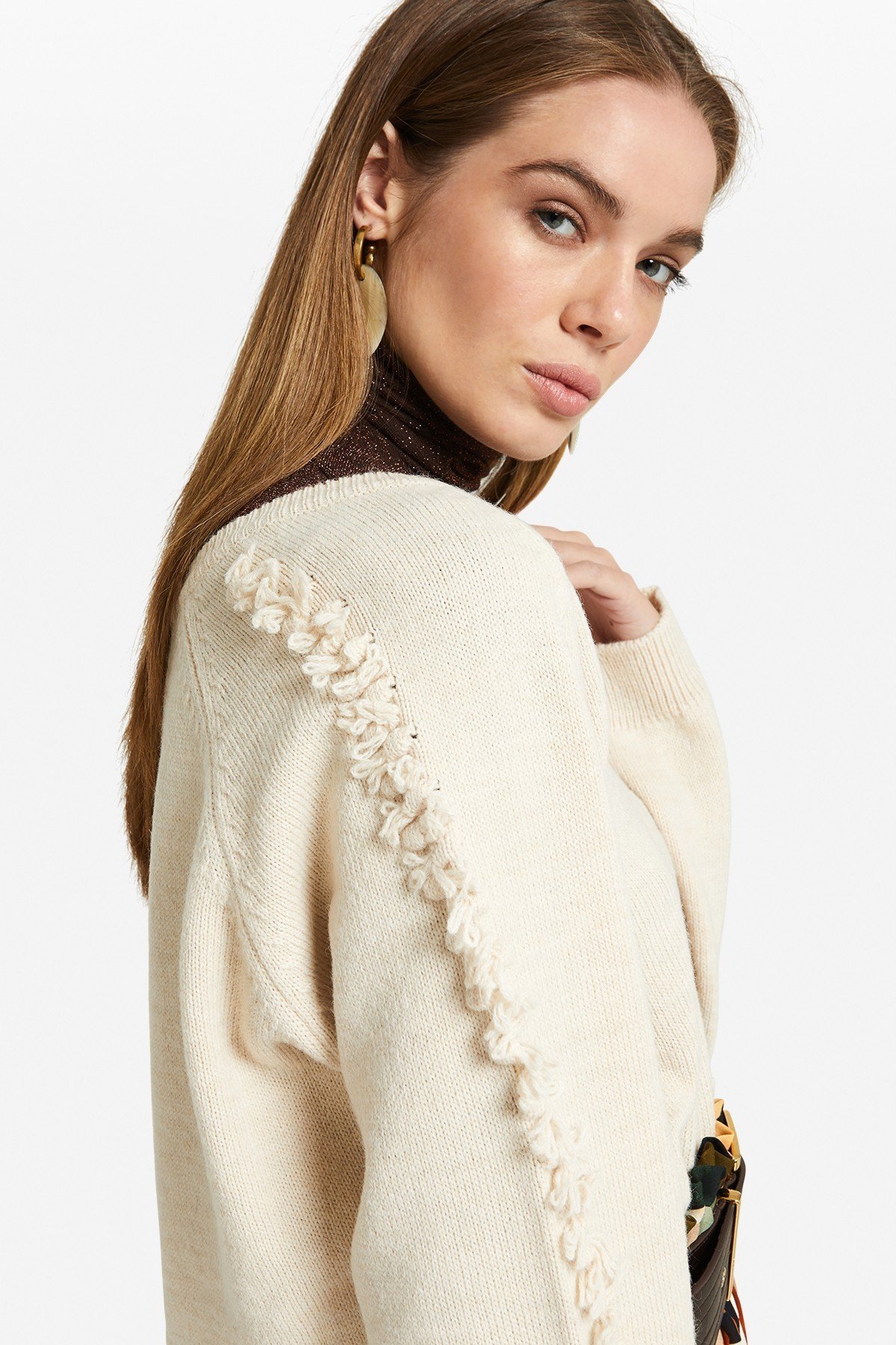 V-neck pullover with appliques on the sleeves