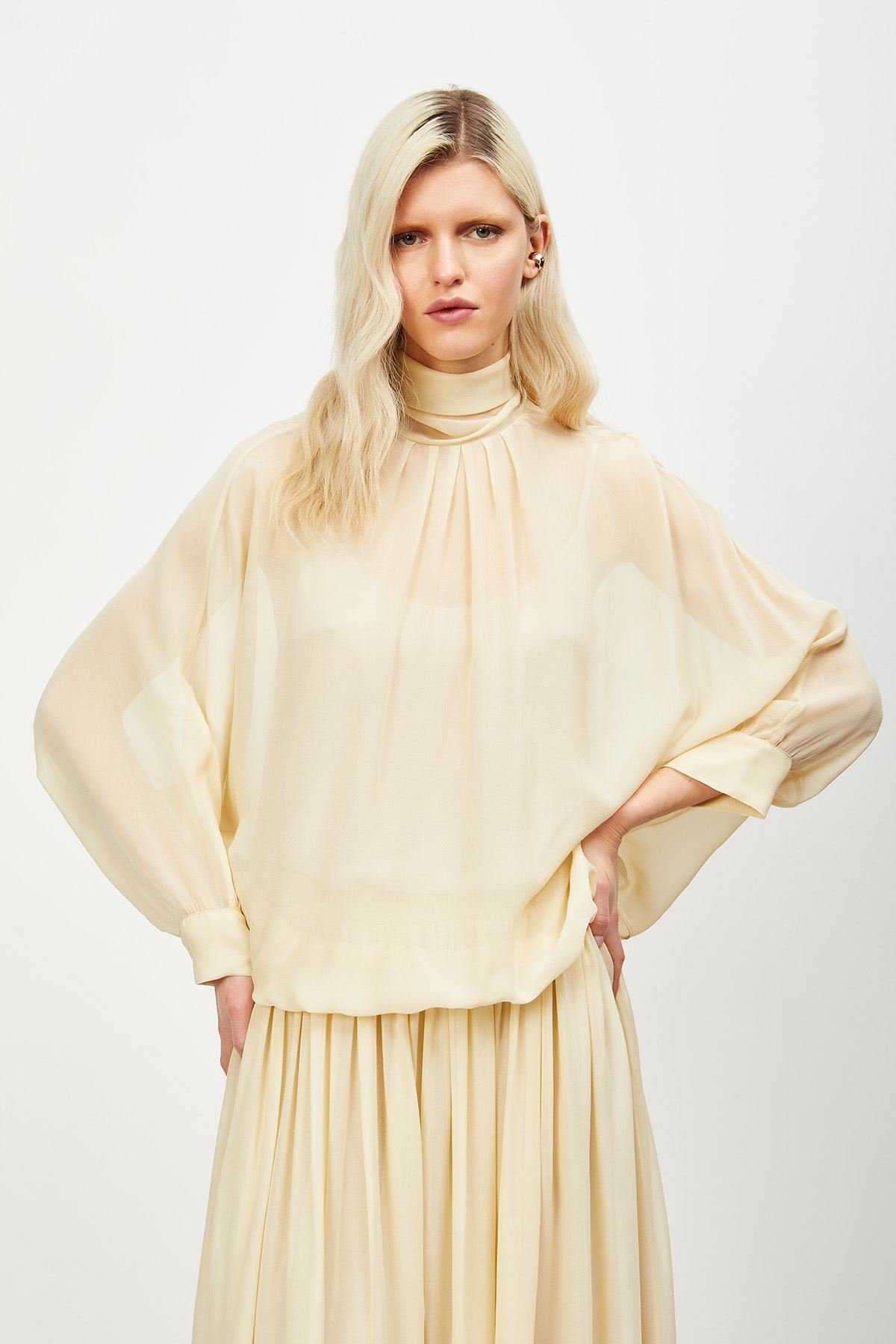 Viscose blouse with scarf-neck.